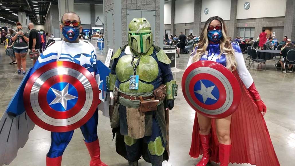 A group of people at a convention cosplaying as their favorite characters.
