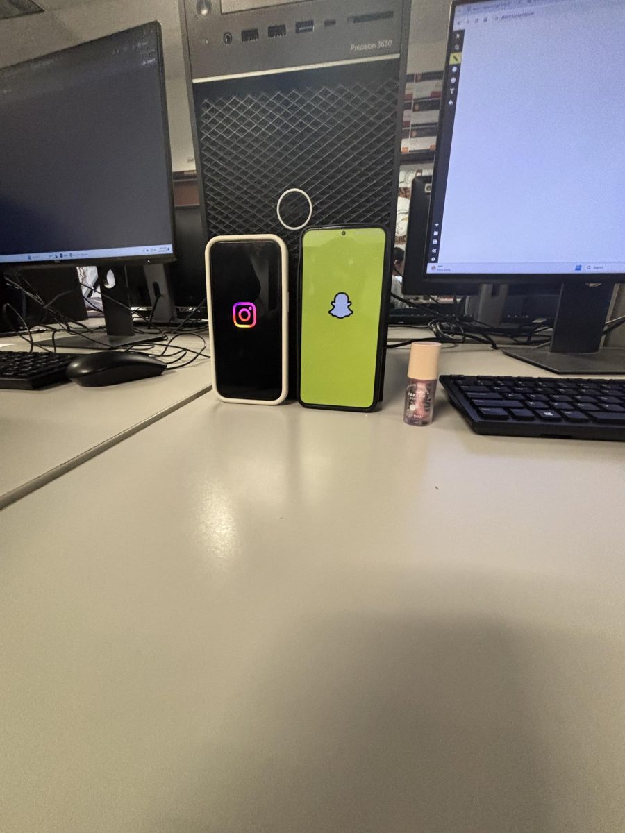 Two phones showcasing Snapchat & Instagram.