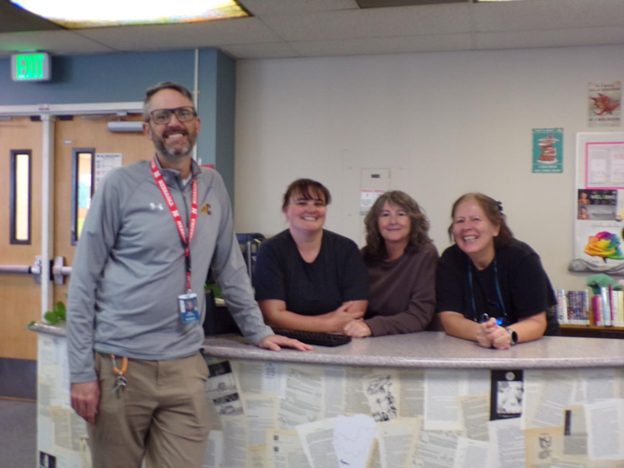 Palmer librarians Mr. Van Kirk, Ms. Ullery, Ms. Allison, and Ms. Vai are ready to greet students entering the library.  