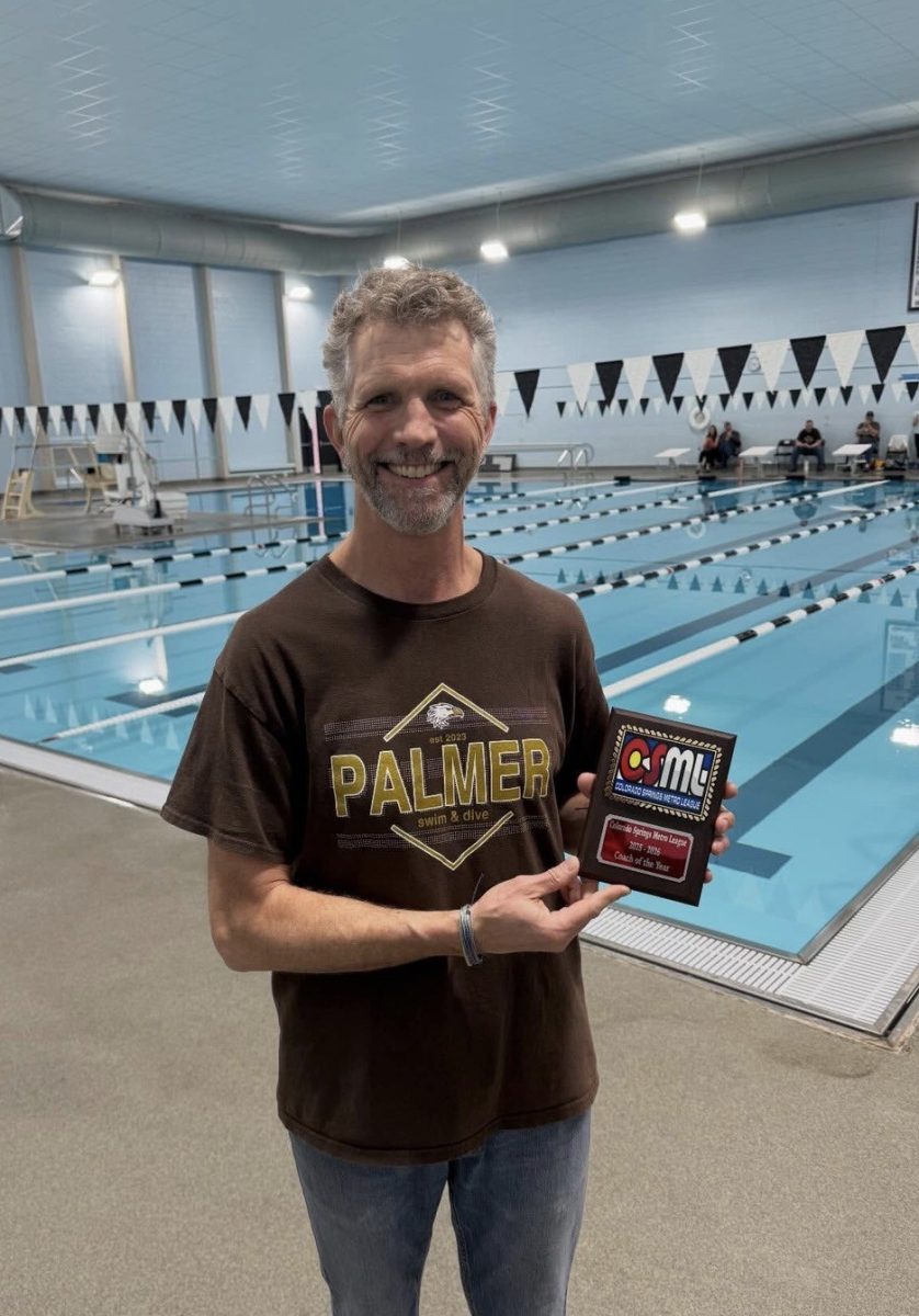 Mr. Lewis after girls' Swim and Dive won their league championship.